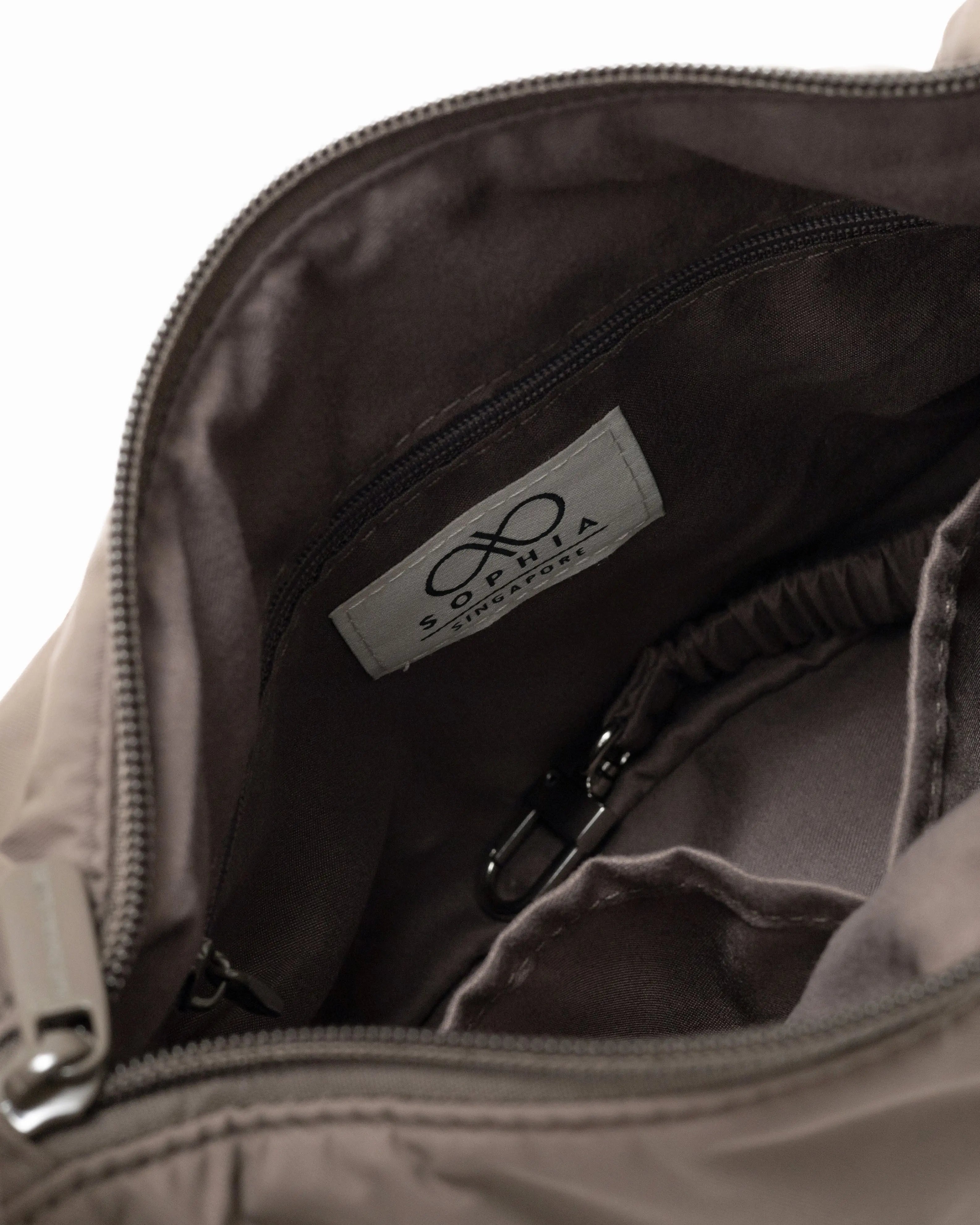 MINI SIGNATURE POCKET CROSSBODY BAG IN POSH TAUPE