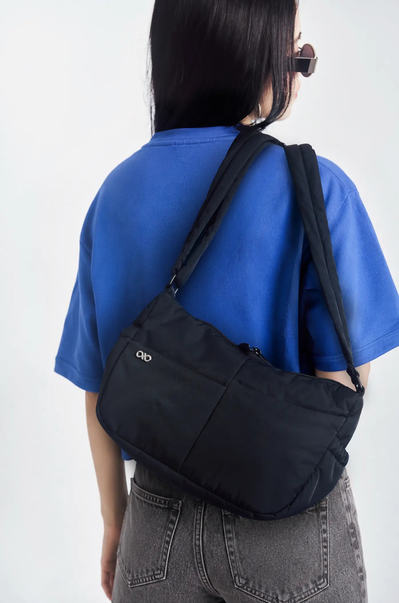 MINI SIGNATURE POCKET CROSSBODY BAG IN POSH JET BLACK