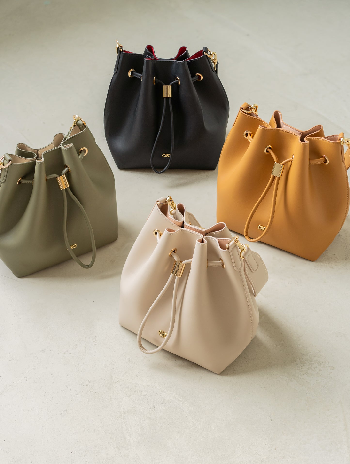 MINI REINA MAGIC BUCKET BAG IN ALMOND